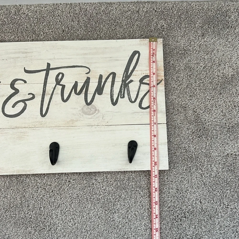 Wooden towels and trunks sign